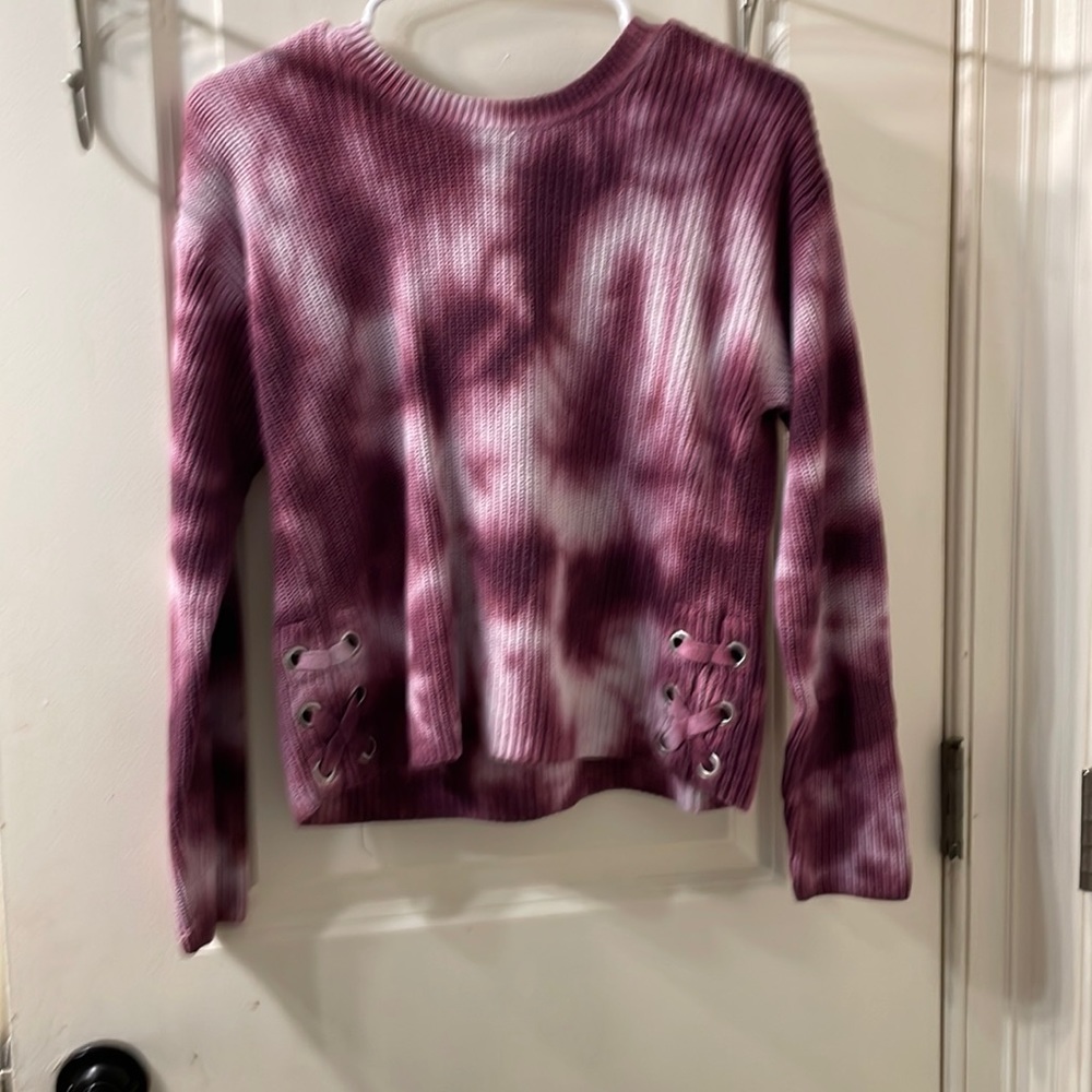 A cropped long sleeve sweater